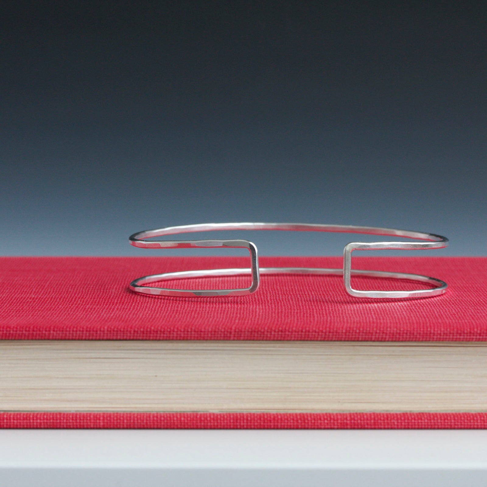 A minimalist and geometric cuff bracelet handmade in sterling silver or 14k gold fill.